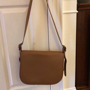 Coach women’s glove tan leather saddle bag